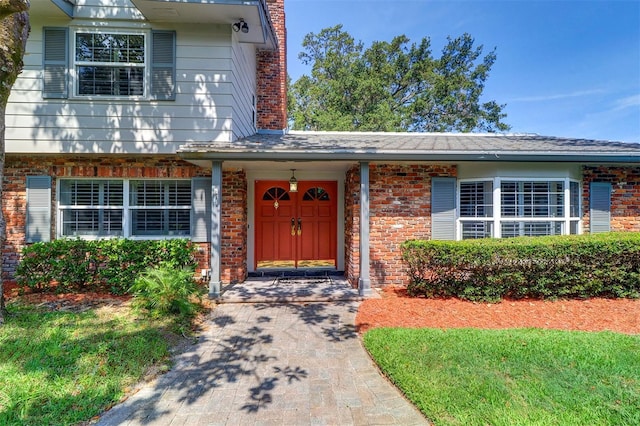 1670 Fox Rd, Clearwater, FL 33764 - doorway to property featuring brick siding