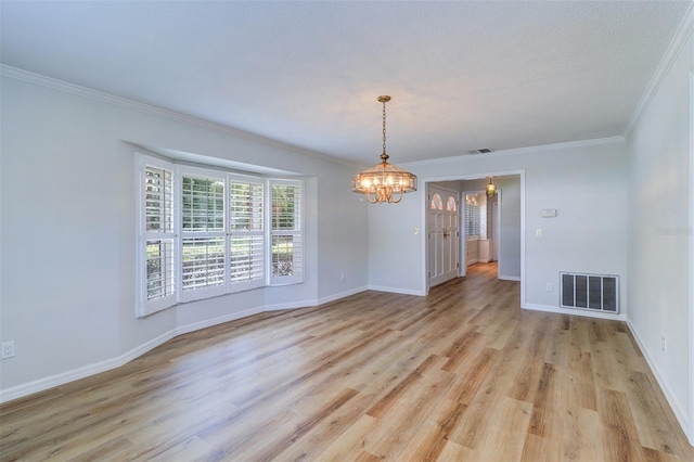 1670 Fox Rd, Clearwater, FL 33764 - unfurnished room featuring a chandelier, ornamental molding, light wood-style floors, and baseboards