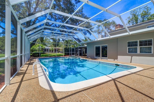 1670 Fox Rd, Clearwater, FL 33764 - outdoor pool featuring glass enclosure and a patio area