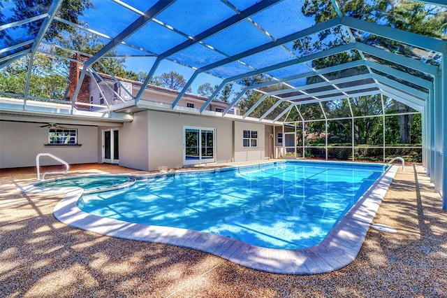 1670 Fox Rd, Clearwater, FL 33764 - view of swimming pool featuring a pool with connected hot tub, a patio, glass enclosure, and a ceiling fan
