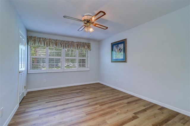 1670 Fox Rd, Clearwater, FL 33764 - unfurnished room with ceiling fan, baseboards, and light wood-style flooring