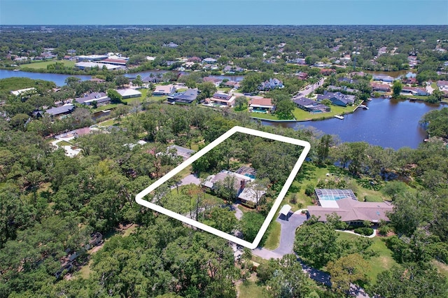 1670 Fox Rd, Clearwater, FL 33764 - aerial perspective of suburban area with property parcel outlined and a large body of water