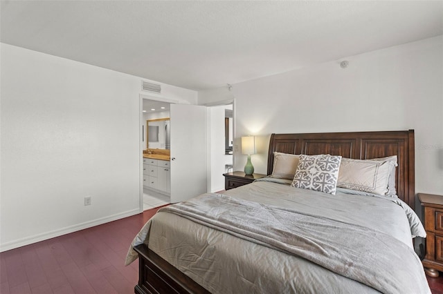 7432 Sunshine Skyway Ln S Unit 402, Saint Petersburg, FL 33711 - bedroom with wood finished floors, baseboards, and ensuite bath