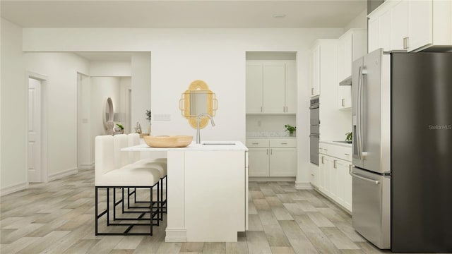 18477 Serene Lake Loop, Lutz, FL 33548 - kitchen with stainless steel refrigerator with ice dispenser, light wood-style flooring, an island with sink, and white cabinets