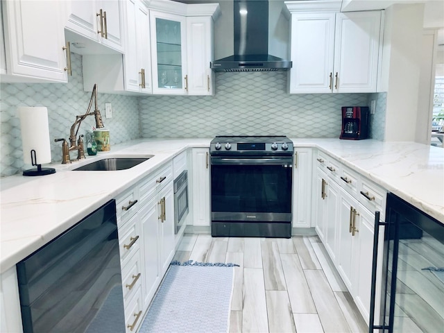 4103 Gulf Blvd Unit 210, St Pete Beach, FL 33706 - kitchen featuring stainless steel electric range, wall chimney range hood, wine cooler, dishwashing machine, and white cabinets