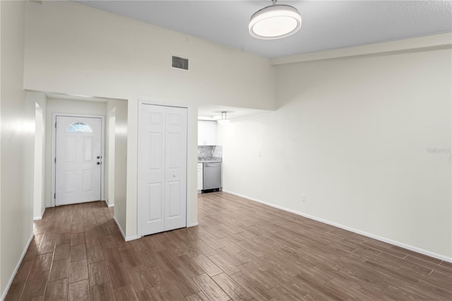 13046 Leverington St, Tampa, FL 33624 - entryway featuring dark wood-type flooring and baseboards