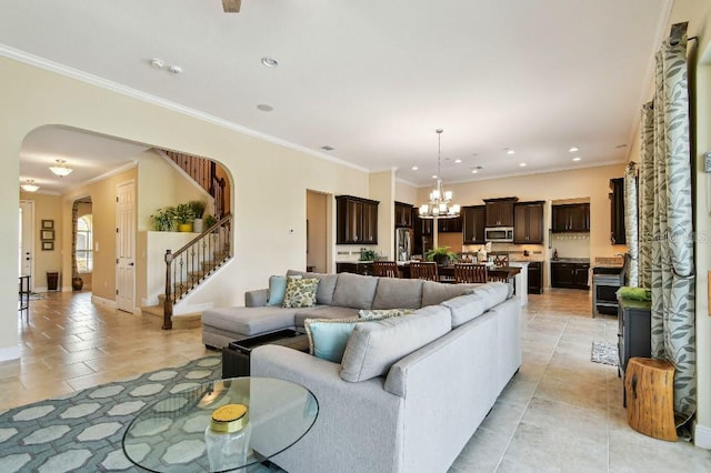 1140 Terralago Way, Kissimmee, FL 34746 - living room featuring arched walkways, a chandelier, stairway, crown molding, and light tile patterned floors