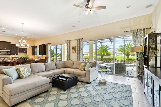 1140 Terralago Way, Kissimmee, FL 34746 - living room featuring plenty of natural light, a chandelier, ceiling fan, light tile patterned flooring, and recessed lighting