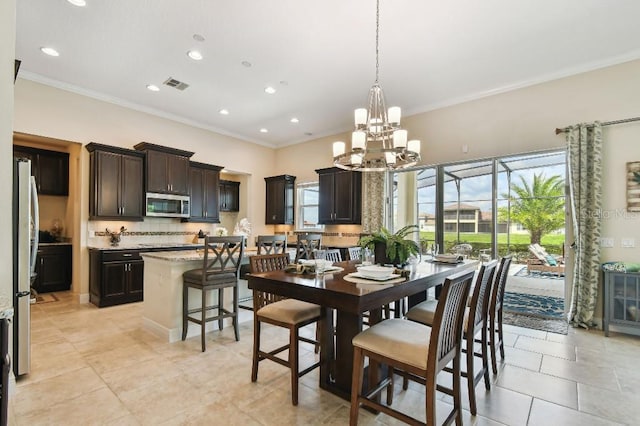 1140 Terralago Way, Kissimmee, FL 34746 - dining room featuring ornamental molding, a chandelier, recessed lighting, and light tile patterned floors