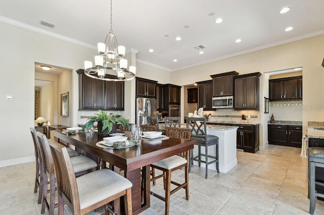 1140 Terralago Way, Kissimmee, FL 34746 - dining area with a chandelier, recessed lighting, ornamental molding, light tile patterned flooring, and baseboards
