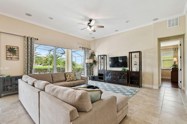 1140 Terralago Way, Kissimmee, FL 34746 - living area featuring ceiling fan, ornamental molding, and baseboards