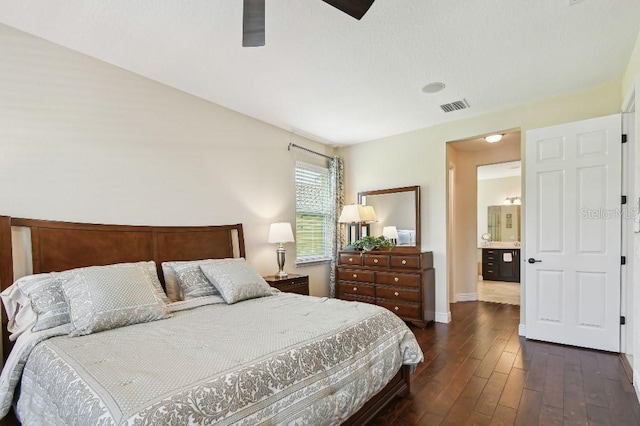 1140 Terralago Way, Kissimmee, FL 34746 - bedroom with dark wood-style flooring, baseboards, and a ceiling fan