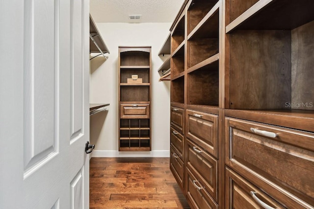 1140 Terralago Way, Kissimmee, FL 34746 - walk in closet featuring dark wood-style floors