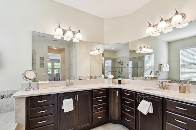 1140 Terralago Way, Kissimmee, FL 34746 - bathroom featuring walk in shower, double vanity, and tile patterned floors