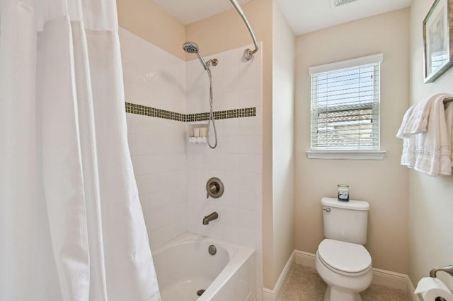 1140 Terralago Way, Kissimmee, FL 34746 - full bathroom with toilet, shower / bath combo with shower curtain, baseboards, and tile patterned floors