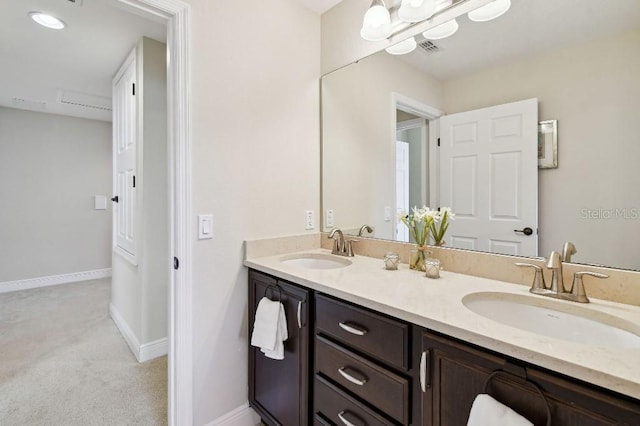 1140 Terralago Way, Kissimmee, FL 34746 - bathroom featuring double vanity and baseboards