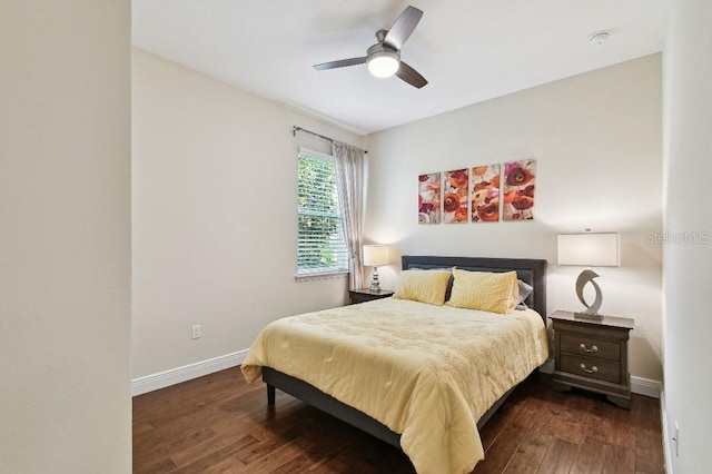 1140 Terralago Way, Kissimmee, FL 34746 - bedroom featuring dark wood-type flooring, baseboards, and a ceiling fan
