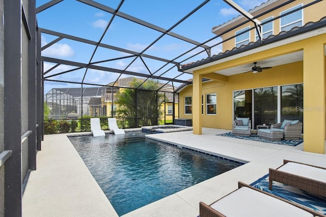 1140 Terralago Way, Kissimmee, FL 34746 - view of pool with an outdoor living space, a patio area, ceiling fan, a pool with connected hot tub, and glass enclosure