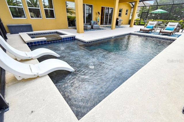 1140 Terralago Way, Kissimmee, FL 34746 - view of pool with a patio area, a pool with connected hot tub, and a lanai