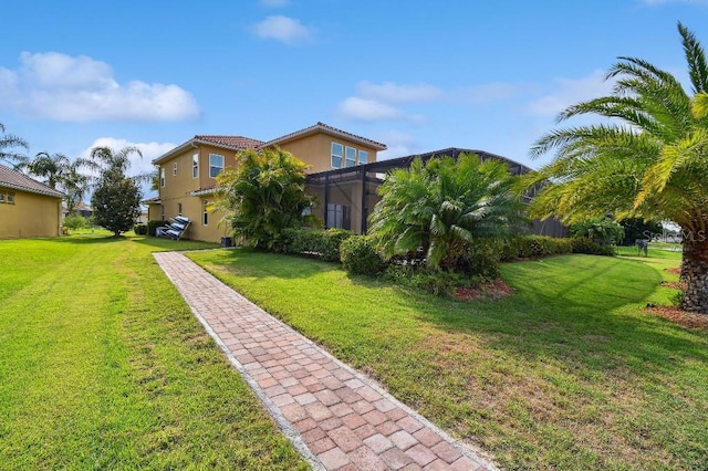 1140 Terralago Way, Kissimmee, FL 34746 - view of grassy yard featuring a lanai
