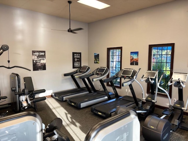 1140 Terralago Way, Kissimmee, FL 34746 - exercise room with carpet, a ceiling fan, baseboards, and a high ceiling