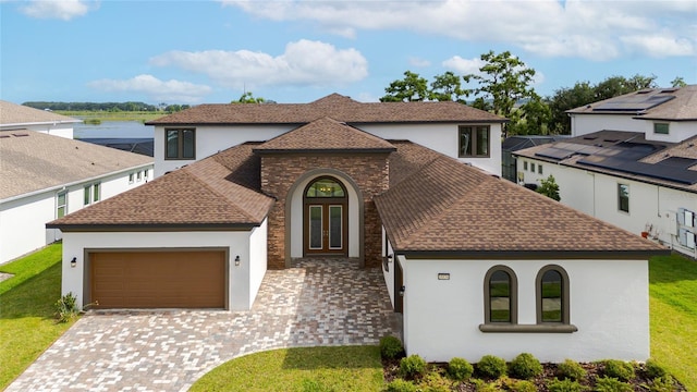 8834 Sanders Tree Loop, Wesley Chapel, FL 33545 - mediterranean / spanish house featuring french doors, stucco siding, and a shingled roof