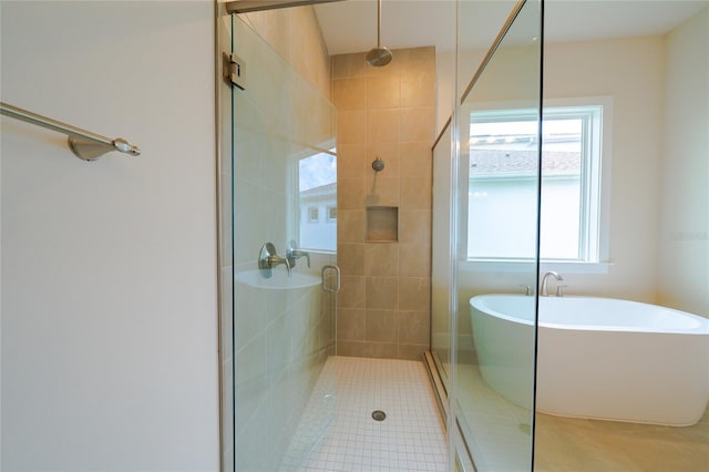 8834 Sanders Tree Loop, Wesley Chapel, FL 33545 - full bathroom with a stall shower, a soaking tub, and tile patterned floors