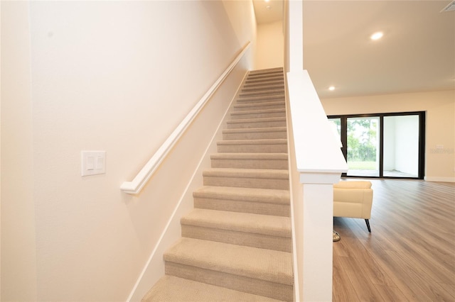 8834 Sanders Tree Loop, Wesley Chapel, FL 33545 - stairway with wood finished floors, recessed lighting, and baseboards