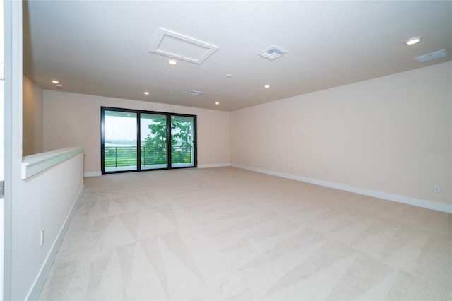 8834 Sanders Tree Loop, Wesley Chapel, FL 33545 - unfurnished room with attic access, light carpet, baseboards, and recessed lighting