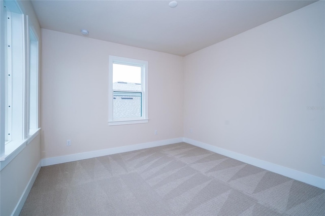 8834 Sanders Tree Loop, Wesley Chapel, FL 33545 - empty room with light colored carpet, baseboards, and a smoke detector