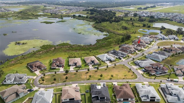 8834 Sanders Tree Loop, Wesley Chapel, FL 33545 - aerial overview of property's location with a large body of water and nearby suburban area