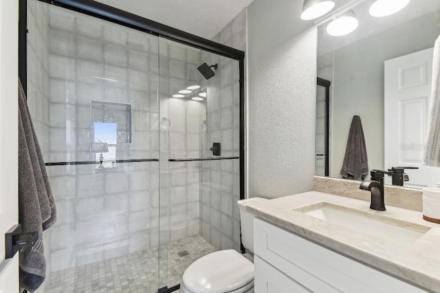 3285 Minnow Creek Dr, Hernando Beach, FL 34607 - full bath featuring vanity, a stall shower, a textured wall, and toilet
