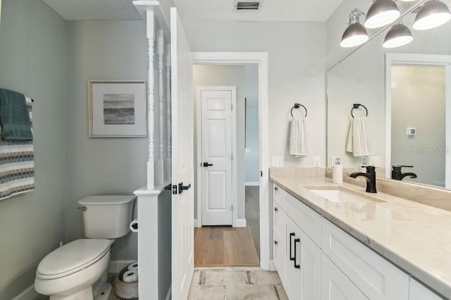 3285 Minnow Creek Dr, Hernando Beach, FL 34607 - full bath featuring vanity, toilet, and baseboards