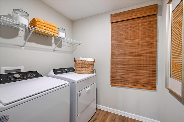 1716 Vanilla St, Haines City, FL 33844 - laundry room with washing machine and dryer, wood finished floors, and baseboards