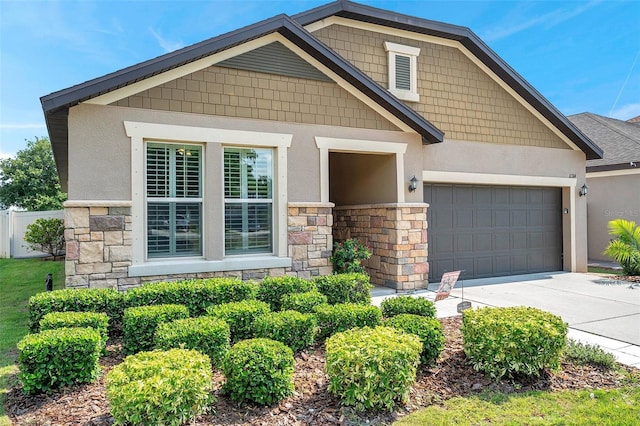 11314 American Holly Dr, Riverview, FL 33578 - craftsman-style home featuring stone siding, an attached garage, stucco siding, and driveway