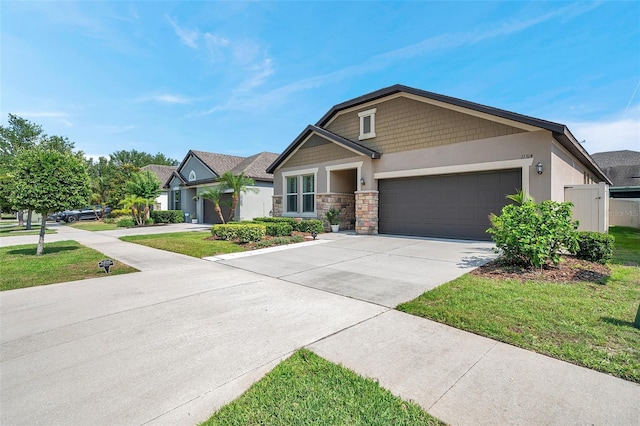 11314 American Holly Dr, Riverview, FL 33578 - view of front facade with an attached garage, concrete driveway, stone siding, and a front yard