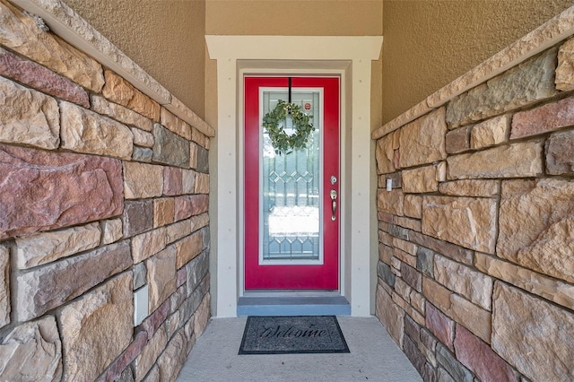 11314 American Holly Dr, Riverview, FL 33578 - view of exterior entry featuring stone siding and stucco siding
