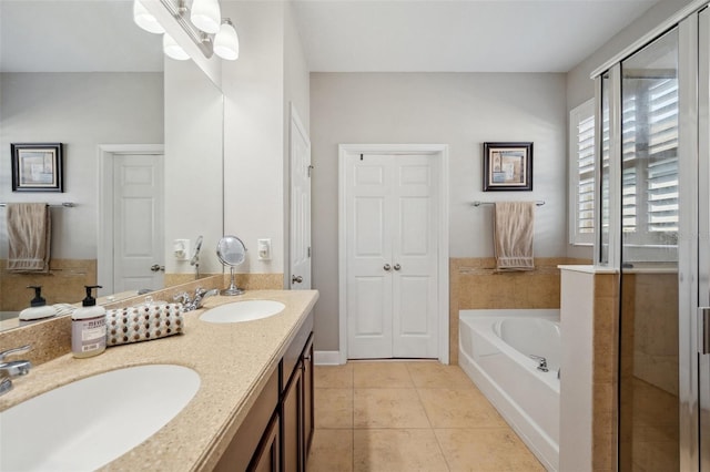 11314 American Holly Dr, Riverview, FL 33578 - bathroom featuring a garden tub, tile patterned flooring, a stall shower, and double vanity