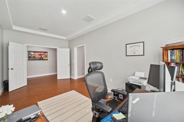 11314 American Holly Dr, Riverview, FL 33578 - home office featuring wood finished floors, baseboards, and a tray ceiling