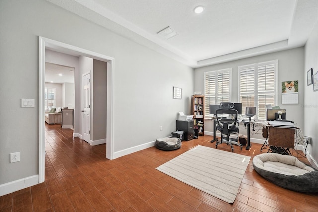11314 American Holly Dr, Riverview, FL 33578 - home office featuring baseboards, wood finished floors, recessed lighting, and a raised ceiling