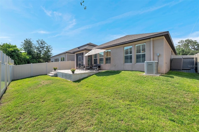 11314 American Holly Dr, Riverview, FL 33578 - back of house with stucco siding, central AC unit, and a patio area