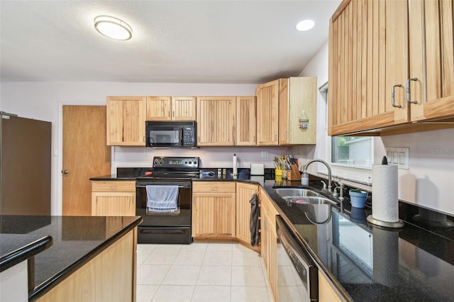 17801 Simmons Rd, Lutz, FL 33548 - kitchen featuring black appliances, a sink, light brown cabinets, dark stone countertops, and light tile patterned flooring