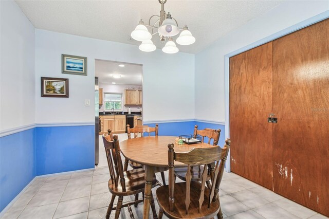17801 Simmons Rd, Lutz, FL 33548 - dining space featuring a chandelier and light tile patterned flooring