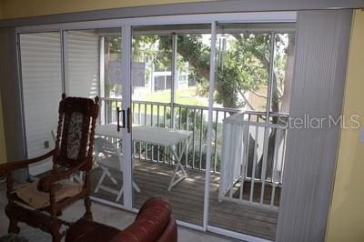 9722 Indian Key Trl Unit 116, Seminole, FL 33776 - doorway featuring carpet and healthy amount of natural light