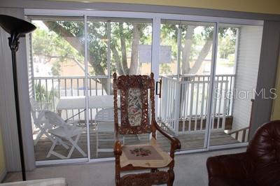 9722 Indian Key Trl Unit 116, Seminole, FL 33776 - entryway featuring carpet flooring