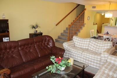 9722 Indian Key Trl Unit 116, Seminole, FL 33776 - living area featuring stairs