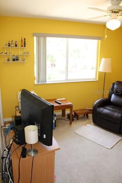 9722 Indian Key Trl Unit 116, Seminole, FL 33776 - living room with ceiling fan and carpet floors