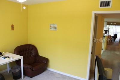 9722 Indian Key Trl Unit 116, Seminole, FL 33776 - sitting room with baseboards