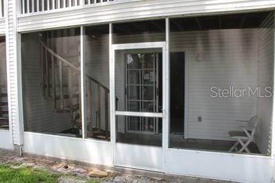 9722 Indian Key Trl Unit 116, Seminole, FL 33776 - view of side of property featuring a sunroom