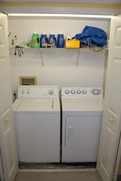 9722 Indian Key Trl Unit 116, Seminole, FL 33776 - washroom with independent washer and dryer